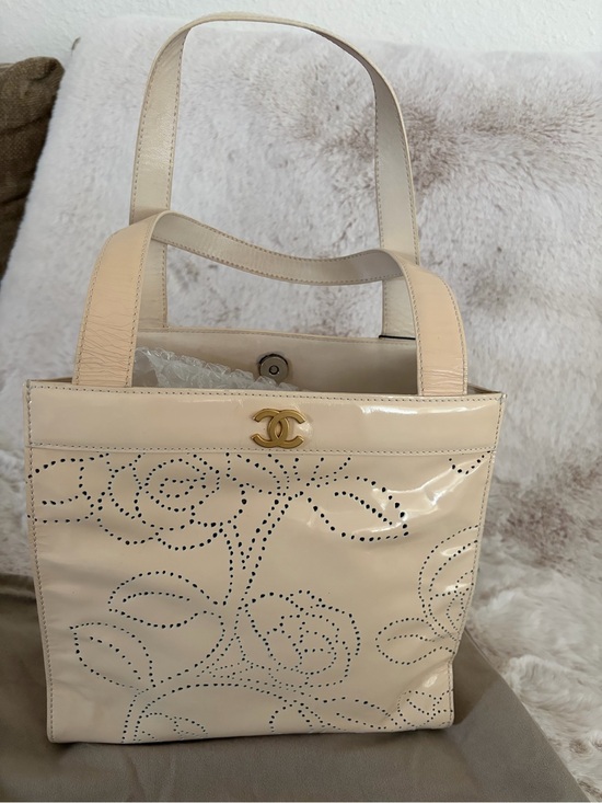 CHANEL Handbags - Chanel Small Beige Patent Leather Floral Perforated Tote
